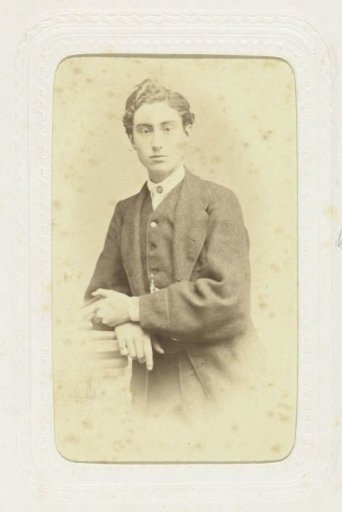 Studio portrait of a young man in costume with dark hair