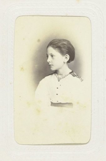 Studio portrait of a girl in a white blouse