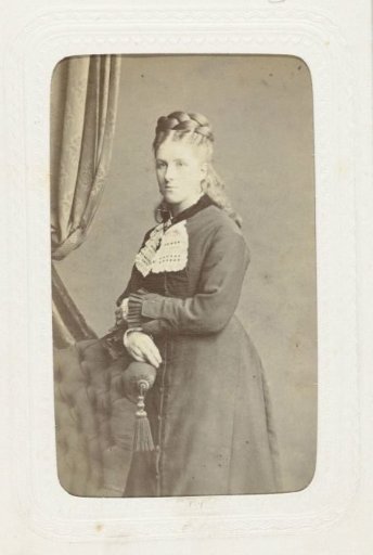 Studio portrait of a woman with a large braid around her head
