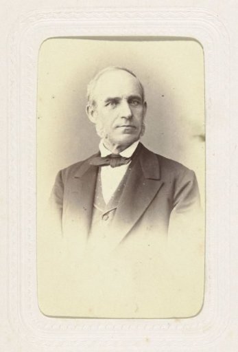 Studio portrait of a man with large sideburns