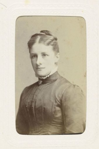 Studio portrait of a woman with her hair up