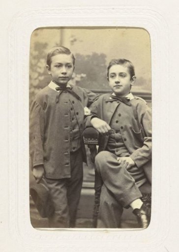 Studio portrait of two boys in the same clothing