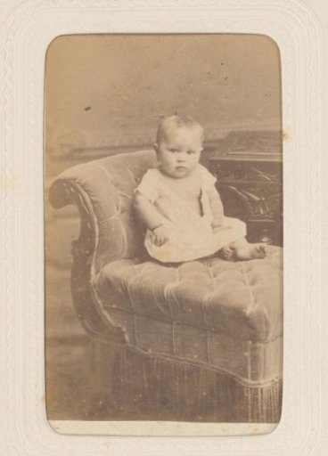 Studio portrait of a baby on a sofa