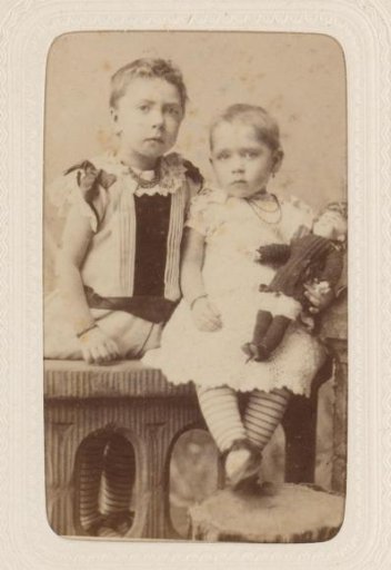 Studio portrait of two children on a table