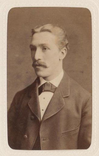 Studio portrait of a man with a mustache