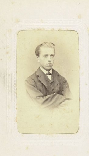 Studio portrait of a boy in an oversized suit