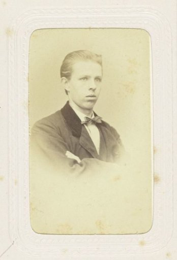 Studio portrait of a young man in a jacket with a velvet collar