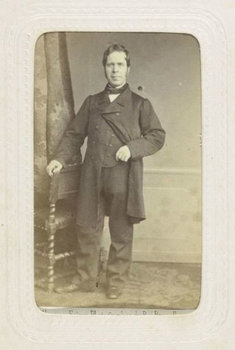 Studio portrait of a man in a long coat