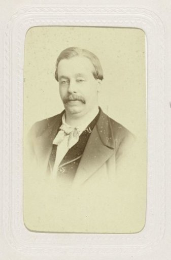 Studio portrait of a stout man with a moustache