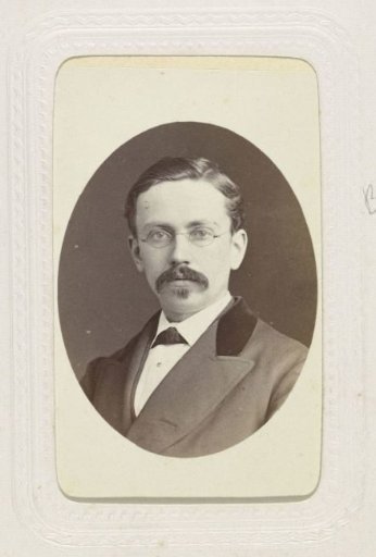 Studio Portrait of a Man with Beard and Glasses