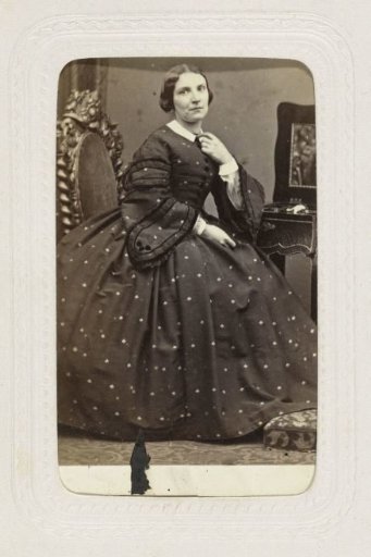 Studio portrait of a woman in a crinoline dress