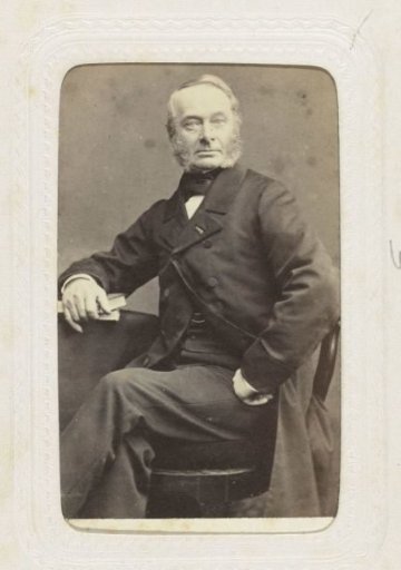 Studio portrait of a man with large sideburns