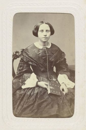 Studio portrait of a young woman dressed in a puffed black dress