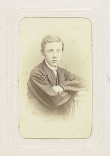 Studio portrait of a boy with his arms crossed