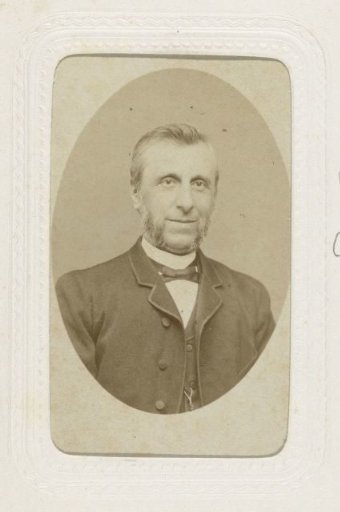 Studio portrait of a man with large sideburns