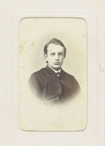 Studio portrait of a boy with a tight parting in his hair