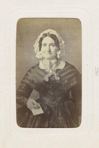 Studio portrait of an older woman in a long, full black dress