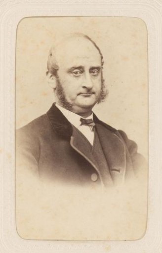 Studio portrait of a man with large sideburns