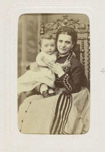 Studio portrait of a woman with a child on her lap