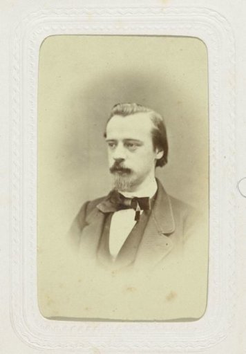 Studio portrait of a man with beard and mustache