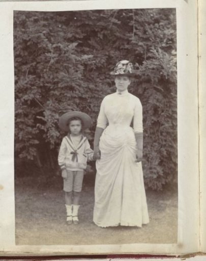 Portrait of a woman and a child hand in hand