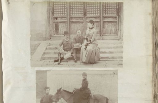 Portrait of Two Men and a Woman Sitting on a Staircase