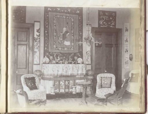 Interior of a sitting room with a wall tapestry, China