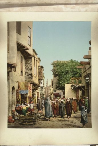 Street scene with a funeral procession in Cairo