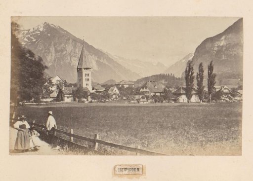 View of Meiringen, Switzerland, with a man, woman and child in the foreground