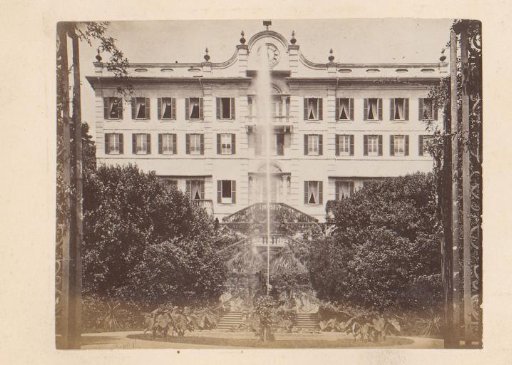 View of a Building with a Fountain at the Front