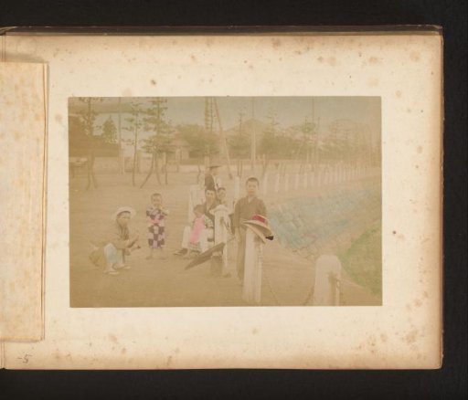 Four men and three children on the street in Japan