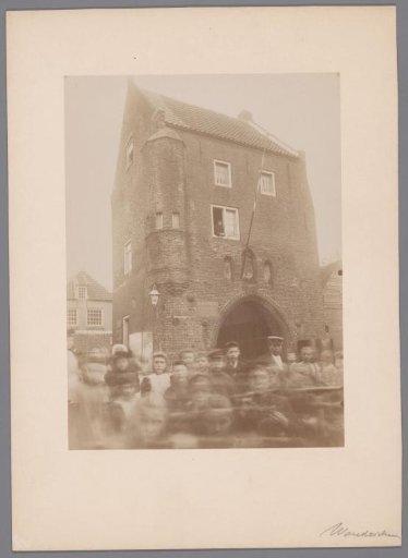 Exterior of the Water Gate on the Maas in Woudrichem, with a crowd in the foreground