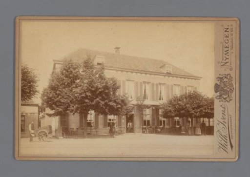 View of a house with trees, people on a terrace