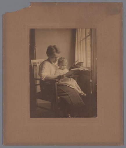 Portrait of a mother with a child on her lap
