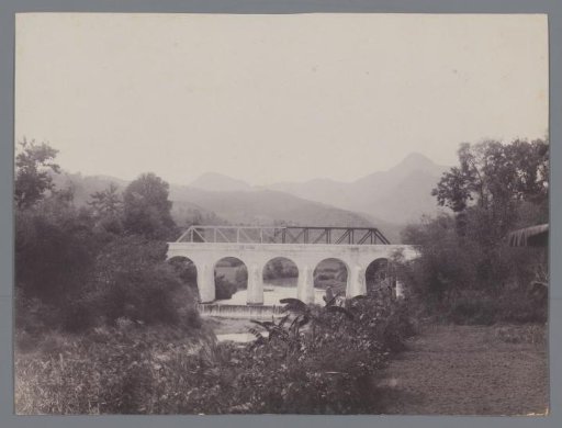 Bridge in the Dutch East Indies with mountains in the background
