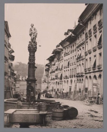 View of a square with houses, a statue of Lady Justice in Austria, Germany, Italy, Switzerland [?]