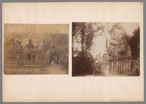 Photograph of a family and two dogs on the steps in front of a house, location unknown.