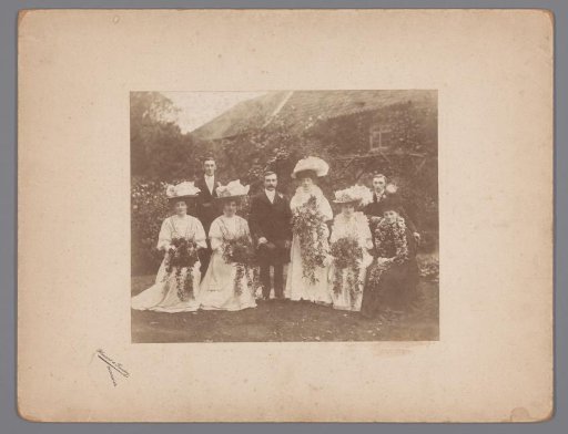 Group portrait in a garden of a bride and groom and family [?], Sheringham [?], England