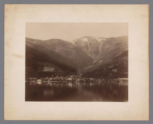 Landscape with a lake and mountains and a place on the shore of the lake
