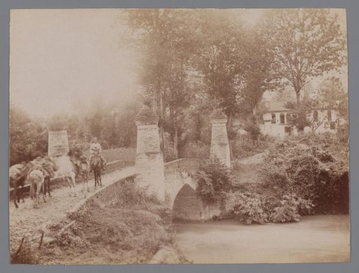 View of a road with houses and several men on donkeys ("La route de Rescht/Koudoum [?]"), Iran