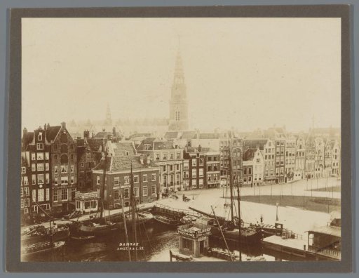 View of the Damrak with the towers of the Oude Kerk and the Zuiderkerk in the background, Amsterdam