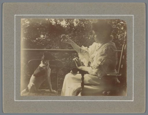 Woman with a Dog on a Balcony