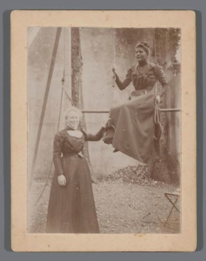 Portrait of two unknown young women in a garden