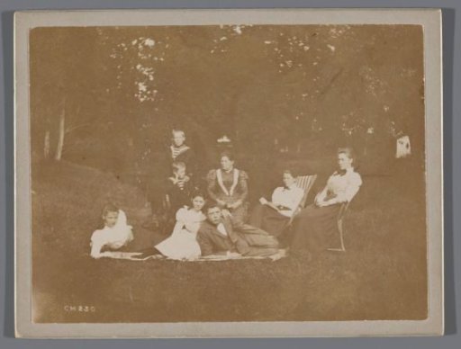 Group portrait of a company in the grass