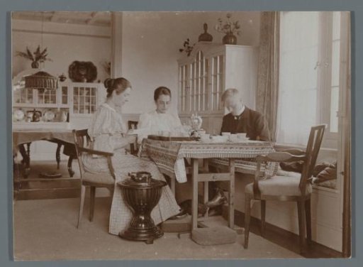 Company drinking tea at a table