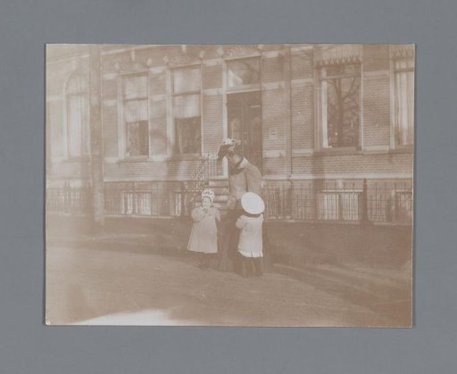 Woman on the Street with Two Children