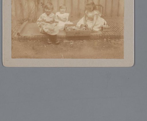 Children Playing Outside with Toys
