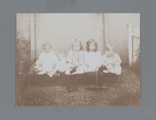 Portrait of four children with toys