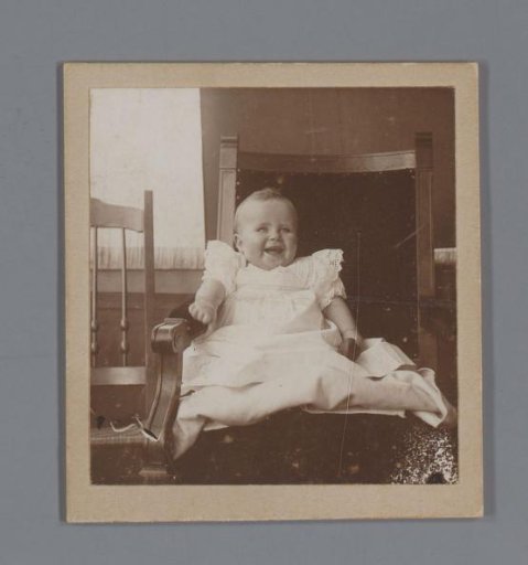 Portrait of a child in a chair