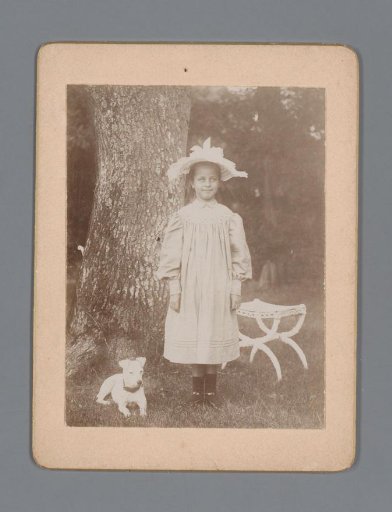 Portrait of an unknown girl with a dog